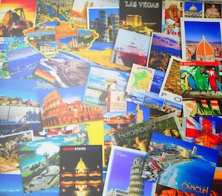 A pile of postcards with different countries/regions Description